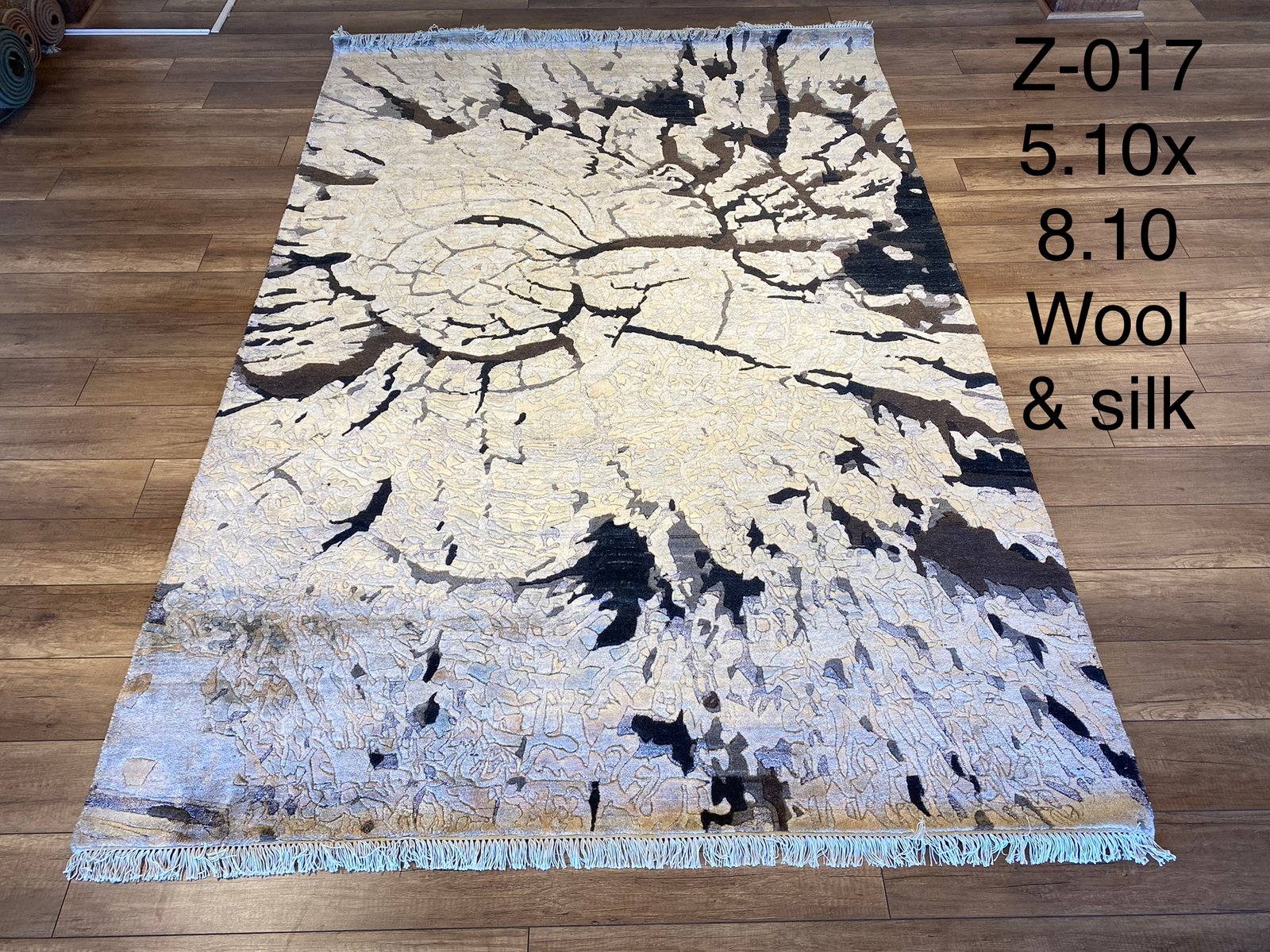 Z-017 Modern Abstract Black/Ivory — A distinguished z-017 modern abstract black/ivory featuring Dramatic tones and abstract design. Available in 5.10x8.10 ft. A statement piece for any space.